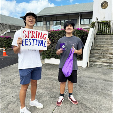 boys holding Spring Festival sign at BSC